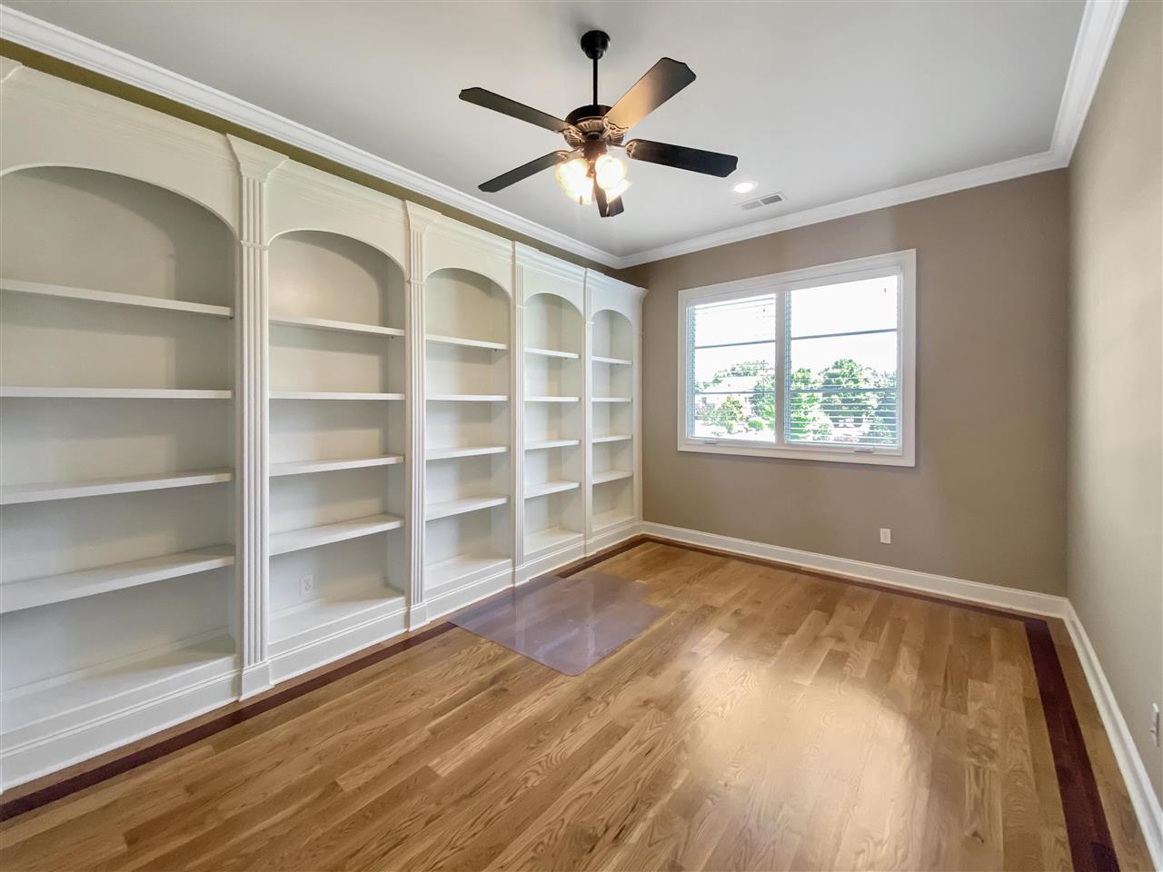 400 Buckland Cove Eads, TN 38028 - Photo 17 of 25 a view of an empty room with a window and wooden floor