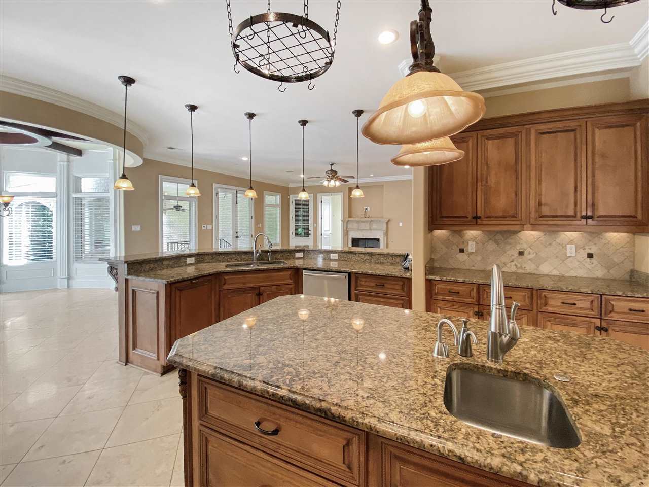 400 Buckland Cove Eads, TN 38028 - Photo 8 of 25 a kitchen with stainless steel appliances granite countertop a sink a oven and a counter space