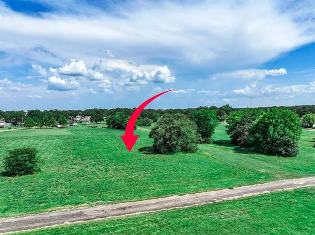 a view of a golf course with swimming pool