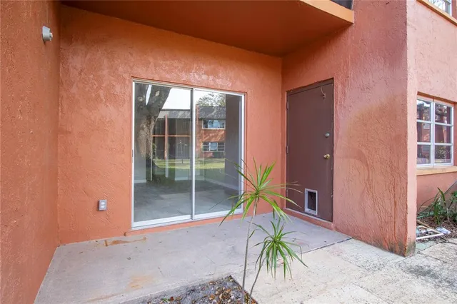 a backyard of a house with seating space