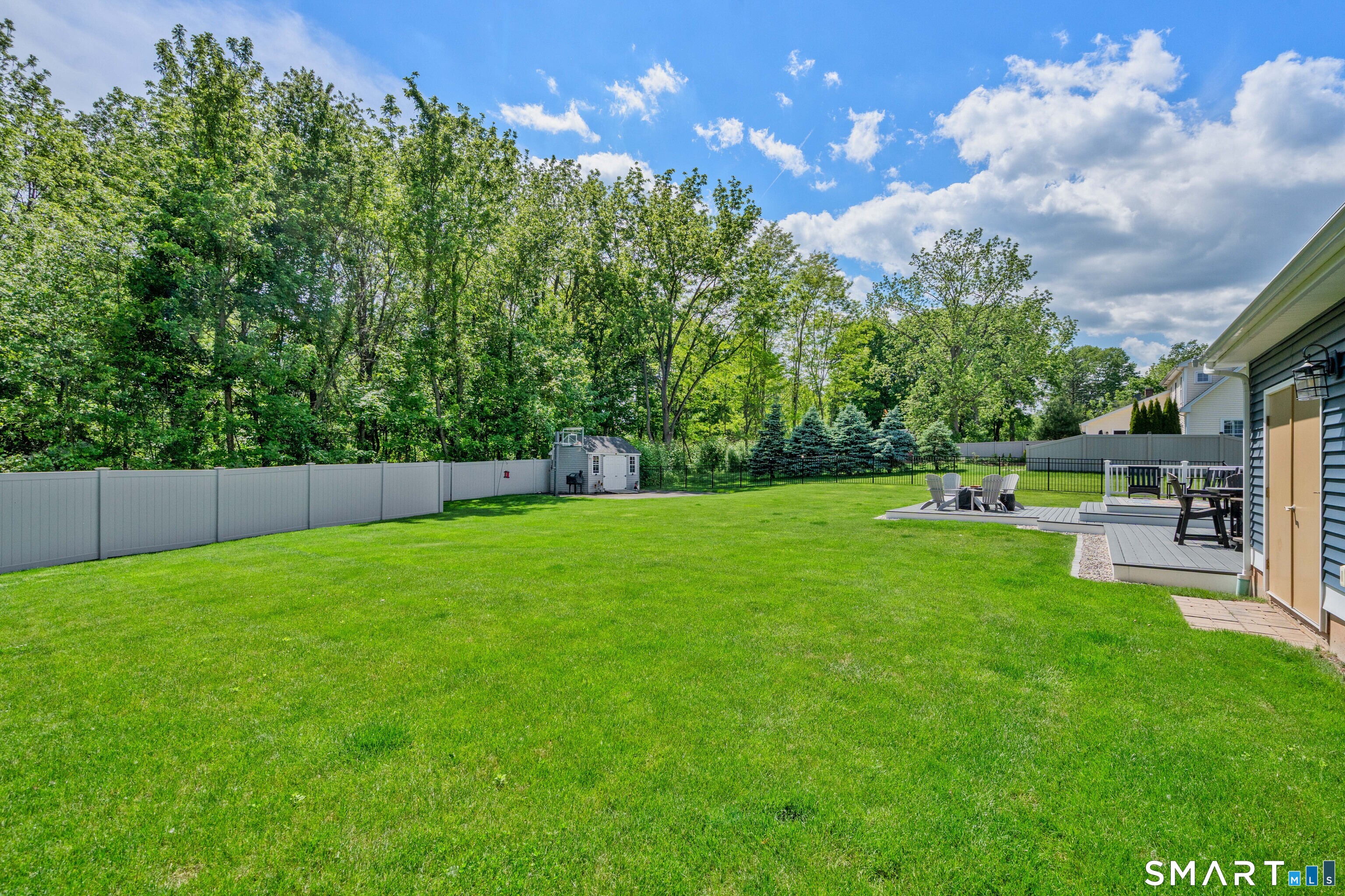 5 Limric Lane Suffield, CT 06078 - Photo 31 of 36 a view of a backyard with sitting area