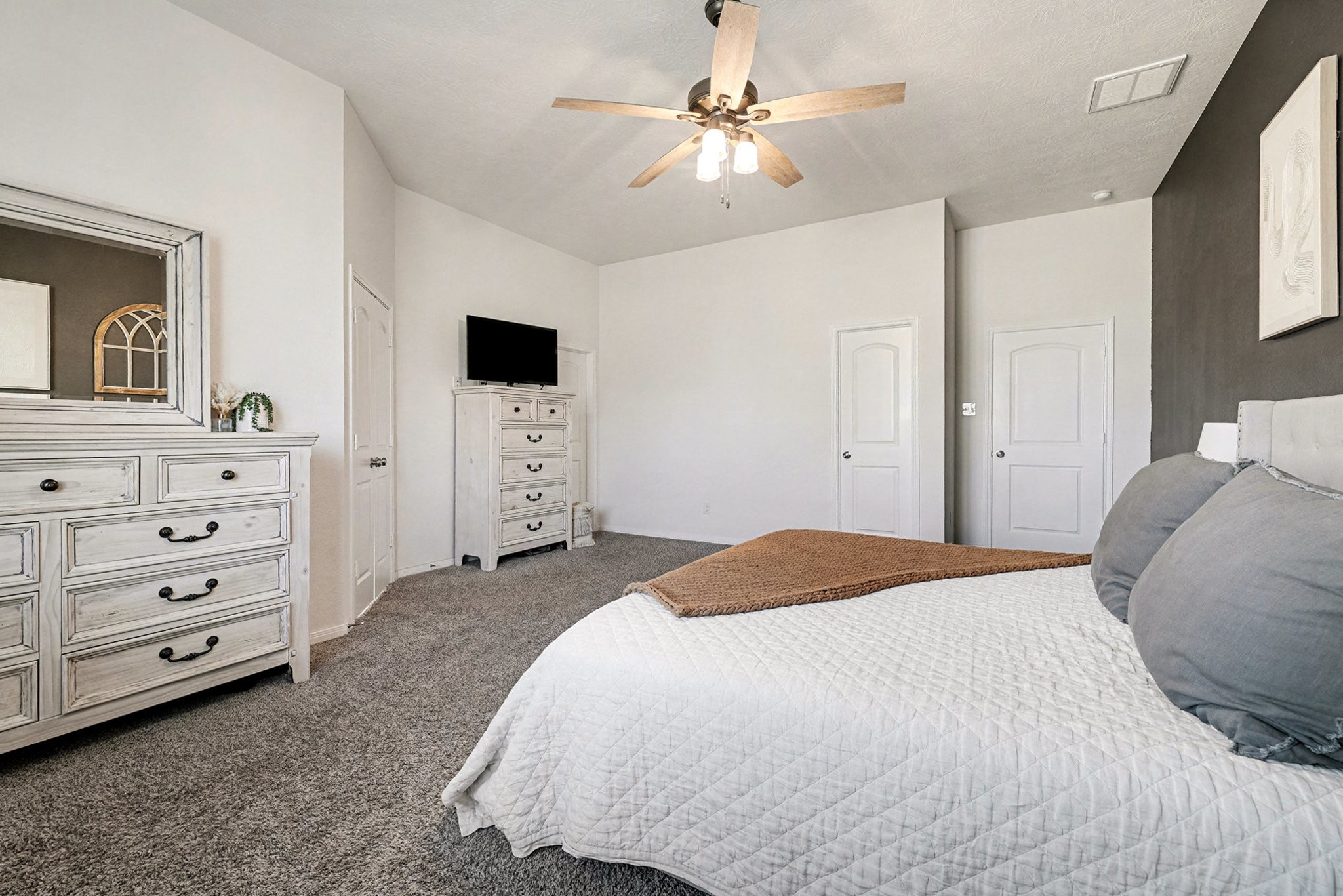 3309 Rolling View Court Conroe, TX 77301 - Photo 16 of 27 This wonderful primary bedroom also has dual walk-in closets.