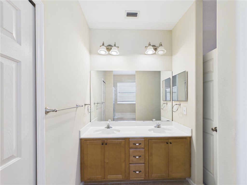 462 Lloyd Street Sebastian, FL 32958 - Photo 21 of 28 a bathroom with a sink and a mirror