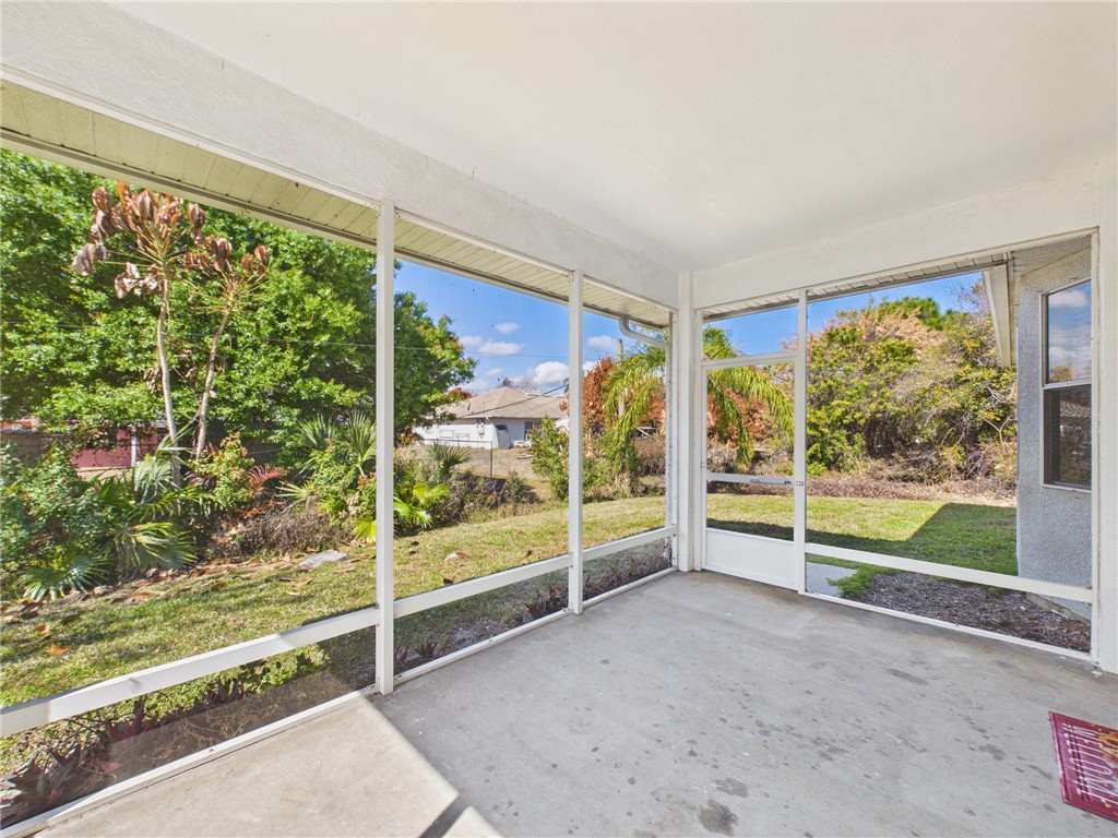 462 Lloyd Street Sebastian, FL 32958 - Photo 27 of 28 a view of an empty room with floor to ceiling windows and yard