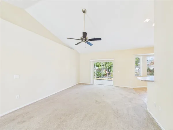 a view of a room with air conditioner and window
