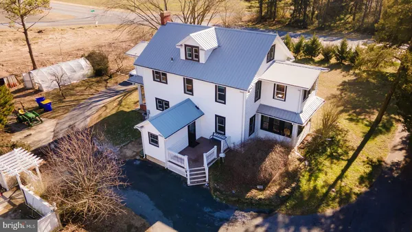a aerial view of a house with a yard