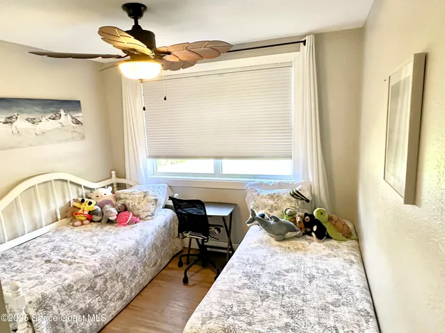 a bed room with a bed furniture and a window