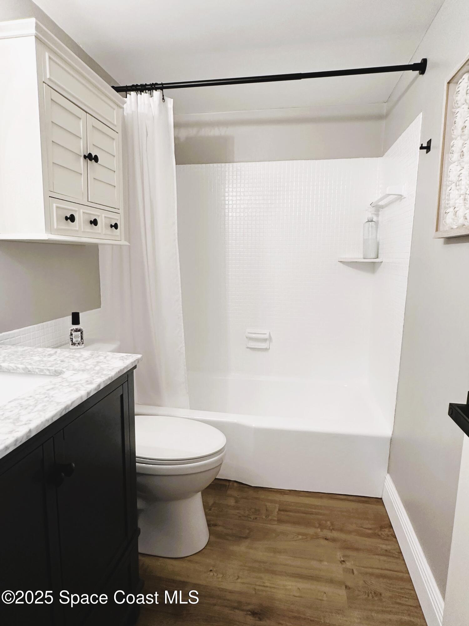 215 Buccaneer Avenue, Unit 3201 Merritt Island, FL 32952 - Photo 16 of 29 a bathroom with a sink and a toilet