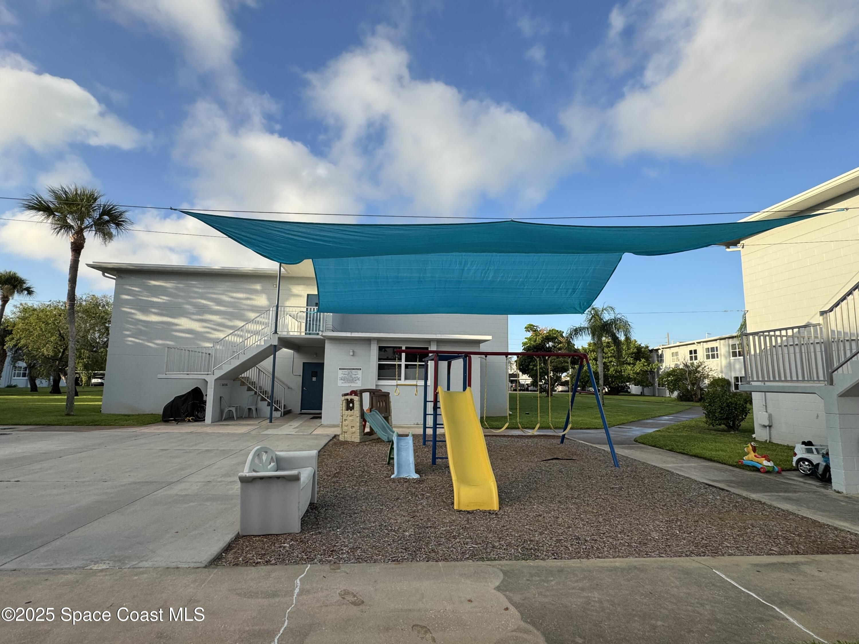 215 Buccaneer Avenue, Unit 3201 Merritt Island, FL 32952 - Photo 21 of 29 a view of a park with slide