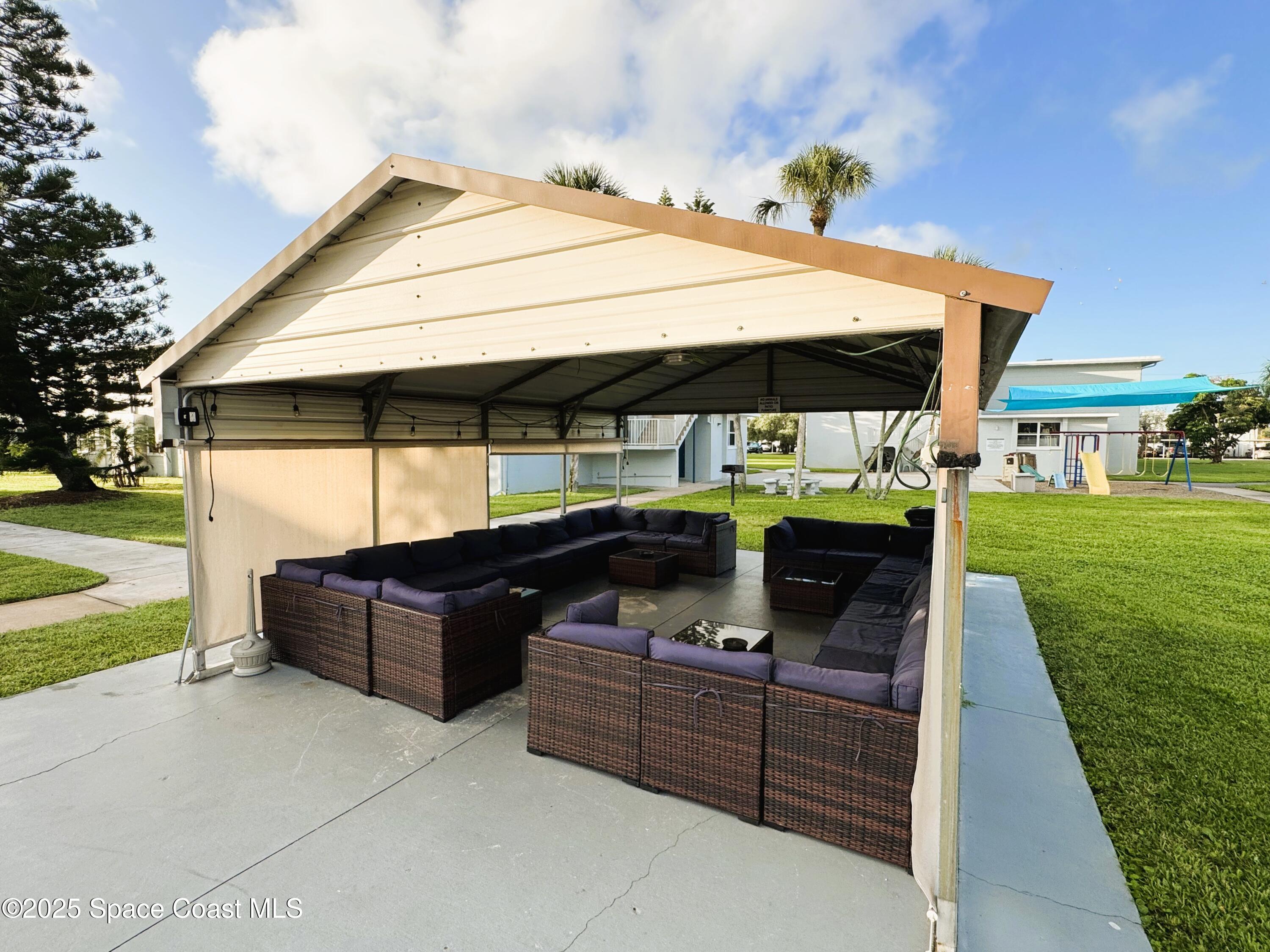 215 Buccaneer Avenue, Unit 3201 Merritt Island, FL 32952 - Photo 22 of 29 a view of outdoor space yard and patio