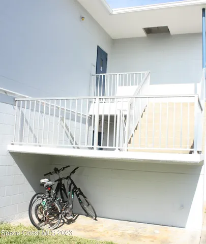a view of a chair and table in a white house