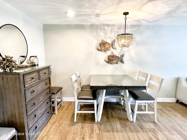 a dining room with a table and chairs