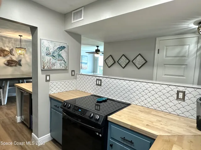 a kitchen with a stove and a refrigerator