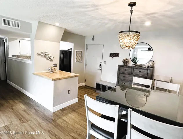 a kitchen with a dining table and chairs