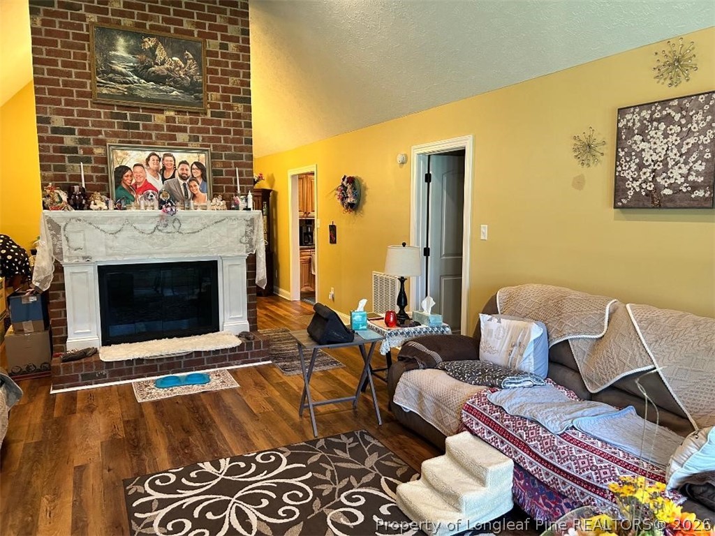 3085 Westminster Road Lumberton, NC 28360 - Photo 2 of 19 a living room with furniture and a fireplace