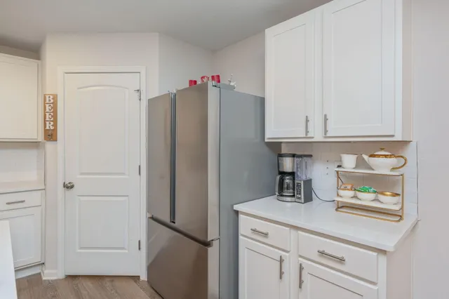 a kitchen with appliances and cabinets