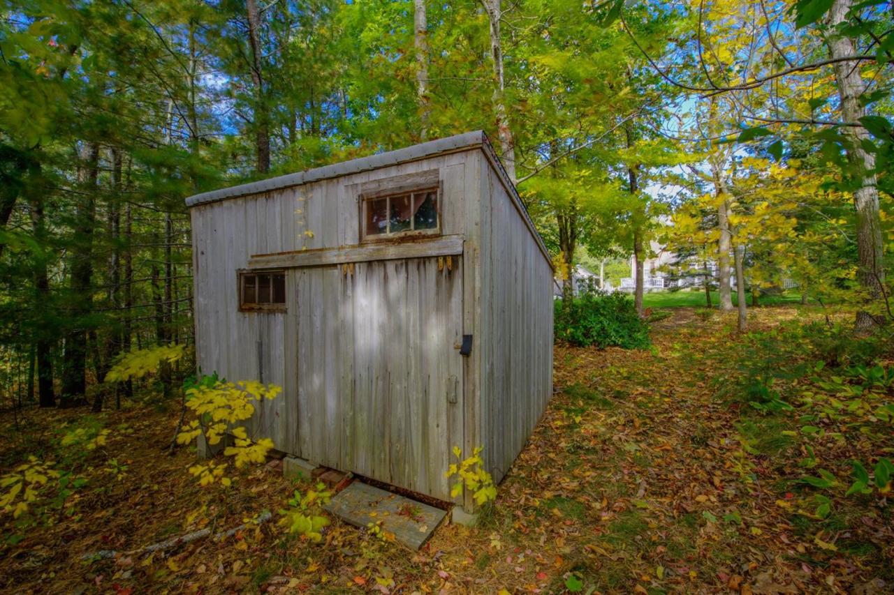 65 Shell Lane Cotuit, MA 02635 - Photo 27 of 32 a backyard of a house with lots of green space
