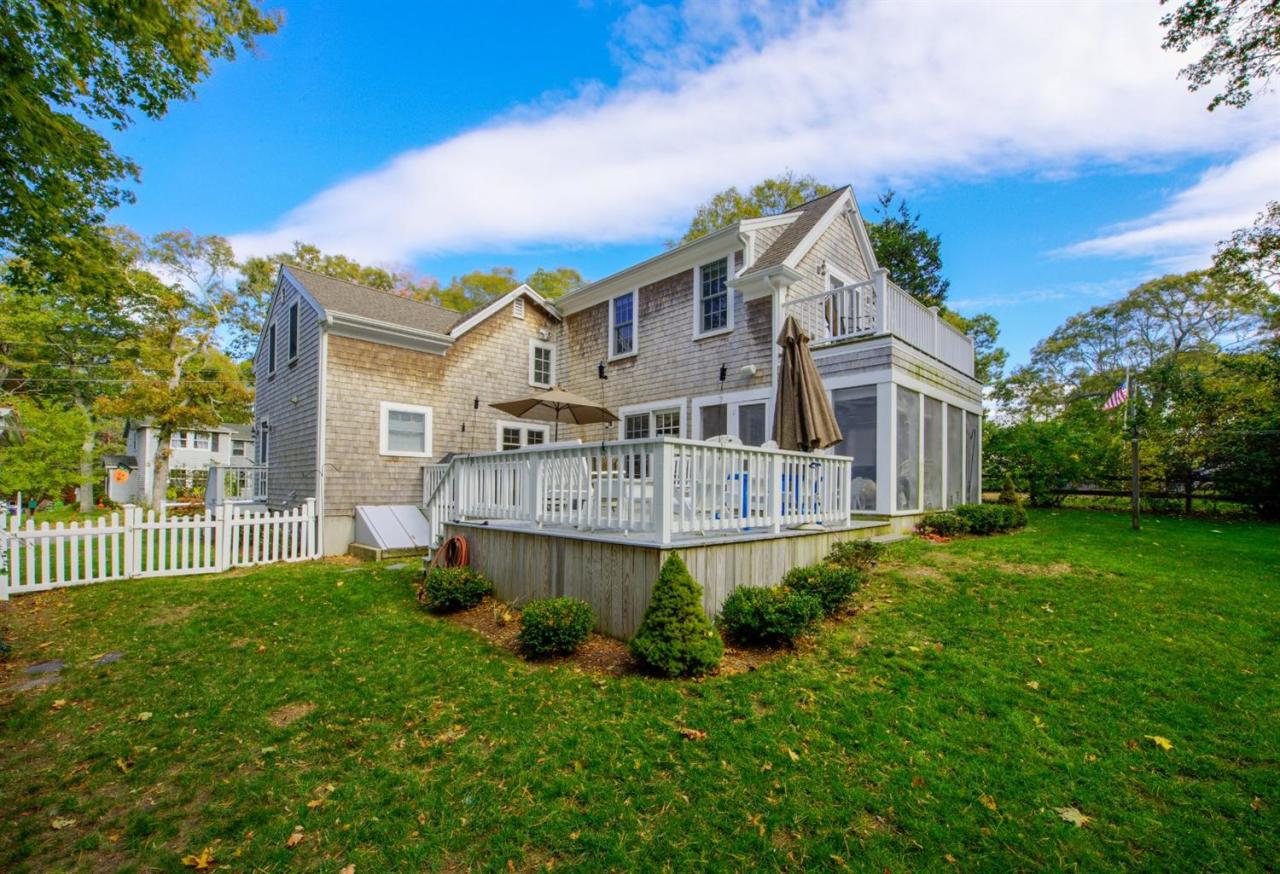 65 Shell Lane Cotuit, MA 02635 - Photo 5 of 32 front view of a house with a yard