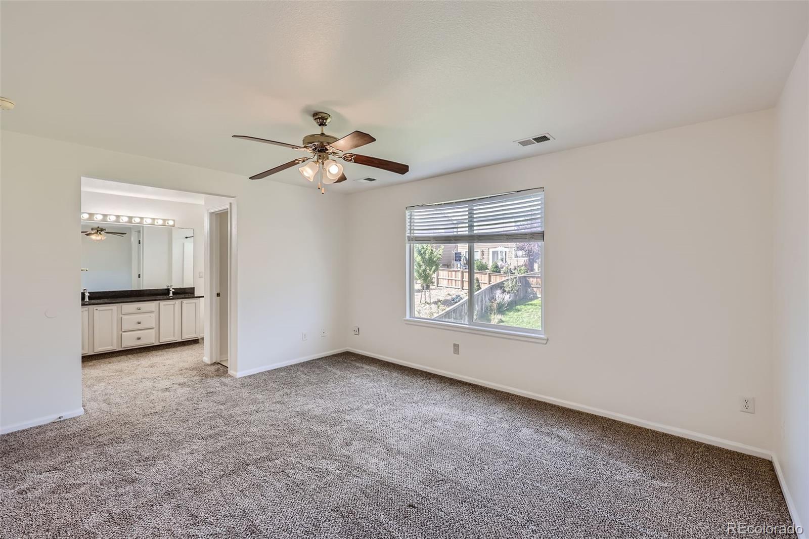 10562 Tracewood Circle Highlands Ranch, CO 80130 - Photo 16 of 28 a view of an empty room with a window