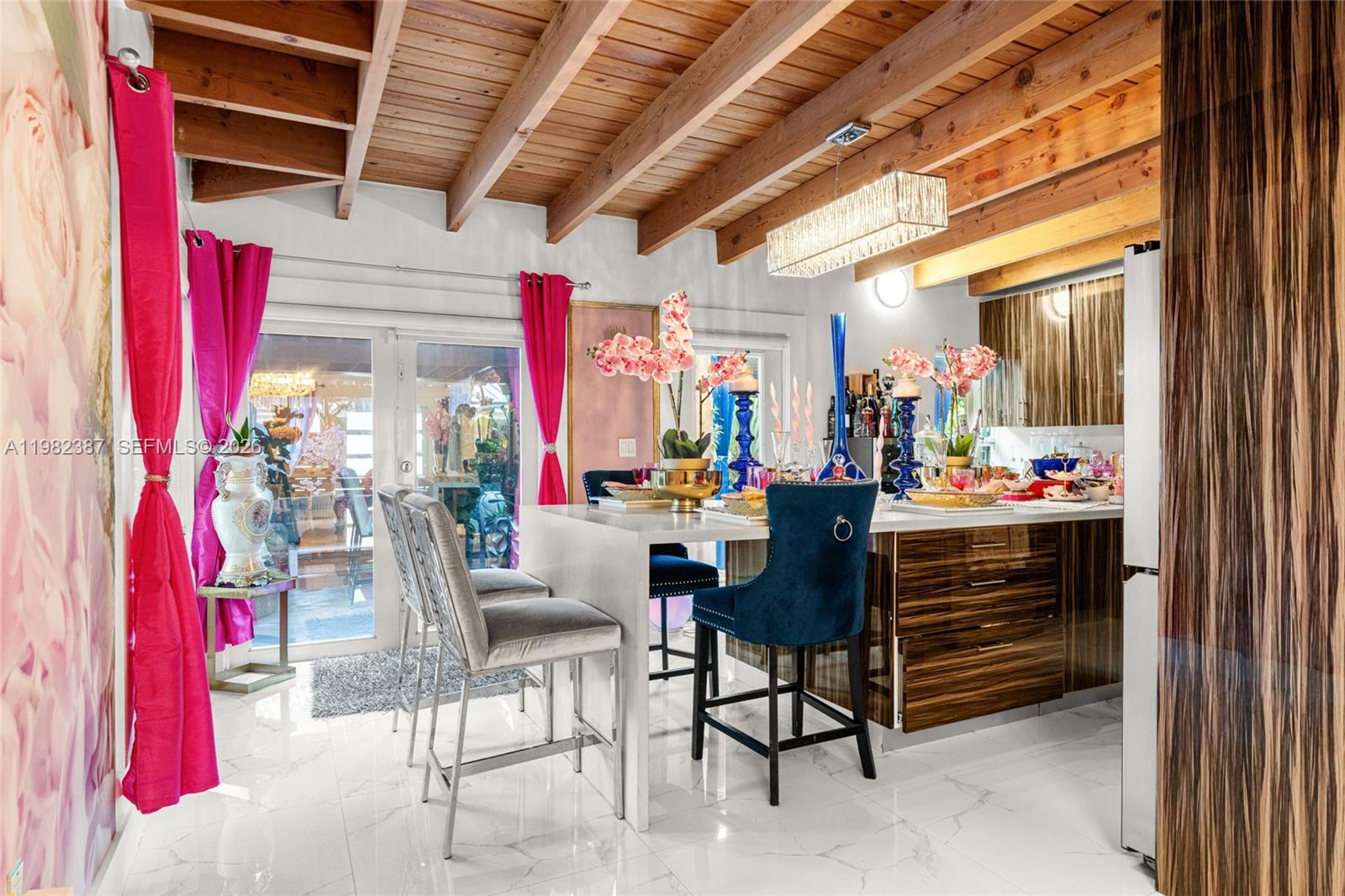 12721 Southwest 47th Street Miami, FL 33175 - Photo 13 of 47 a room with furniture and a chandelier