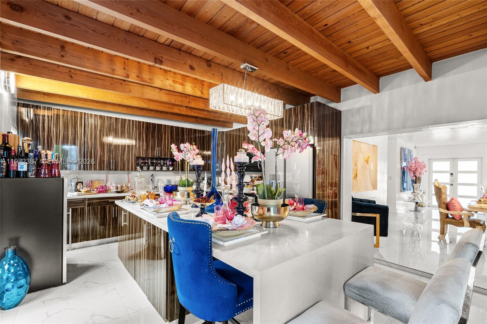 12721 Southwest 47th Street Miami, FL 33175 - Photo 15 of 47 a view of a dining room with furniture and a chandelier