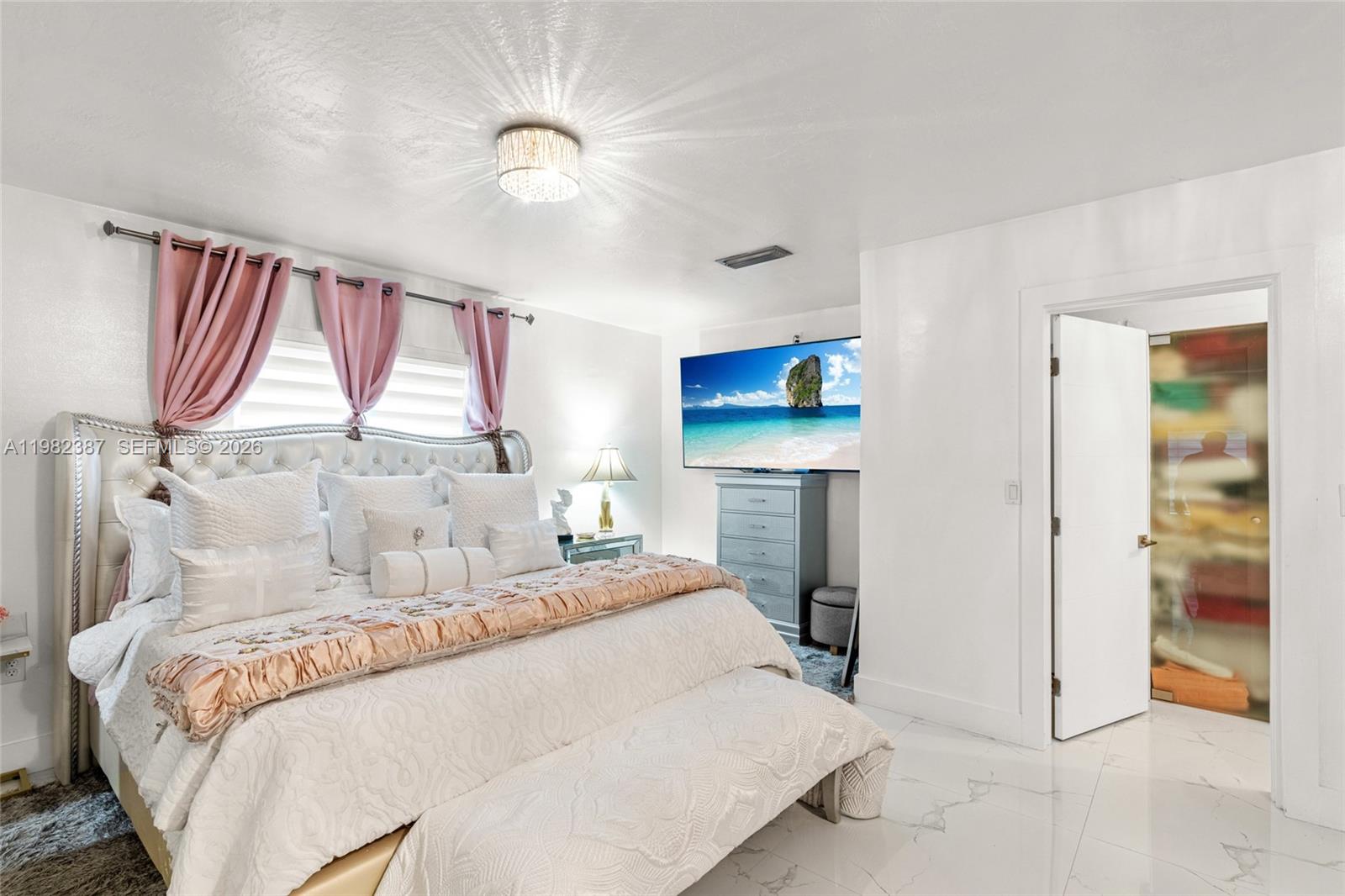 12721 Southwest 47th Street Miami, FL 33175 - Photo 21 of 47 a bedroom with a bed and a painting on the wall