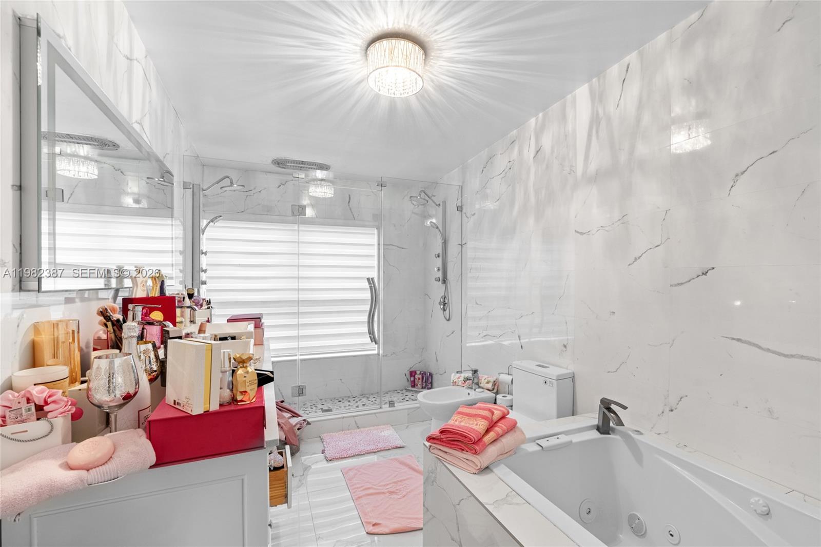 12721 Southwest 47th Street Miami, FL 33175 - Photo 22 of 47 a bathroom with a tub sink and window