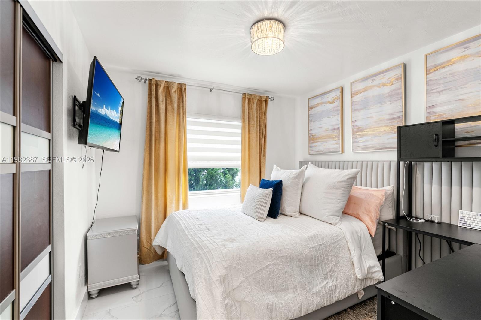 12721 Southwest 47th Street Miami, FL 33175 - Photo 24 of 47 a bedroom with a bed tv and a window