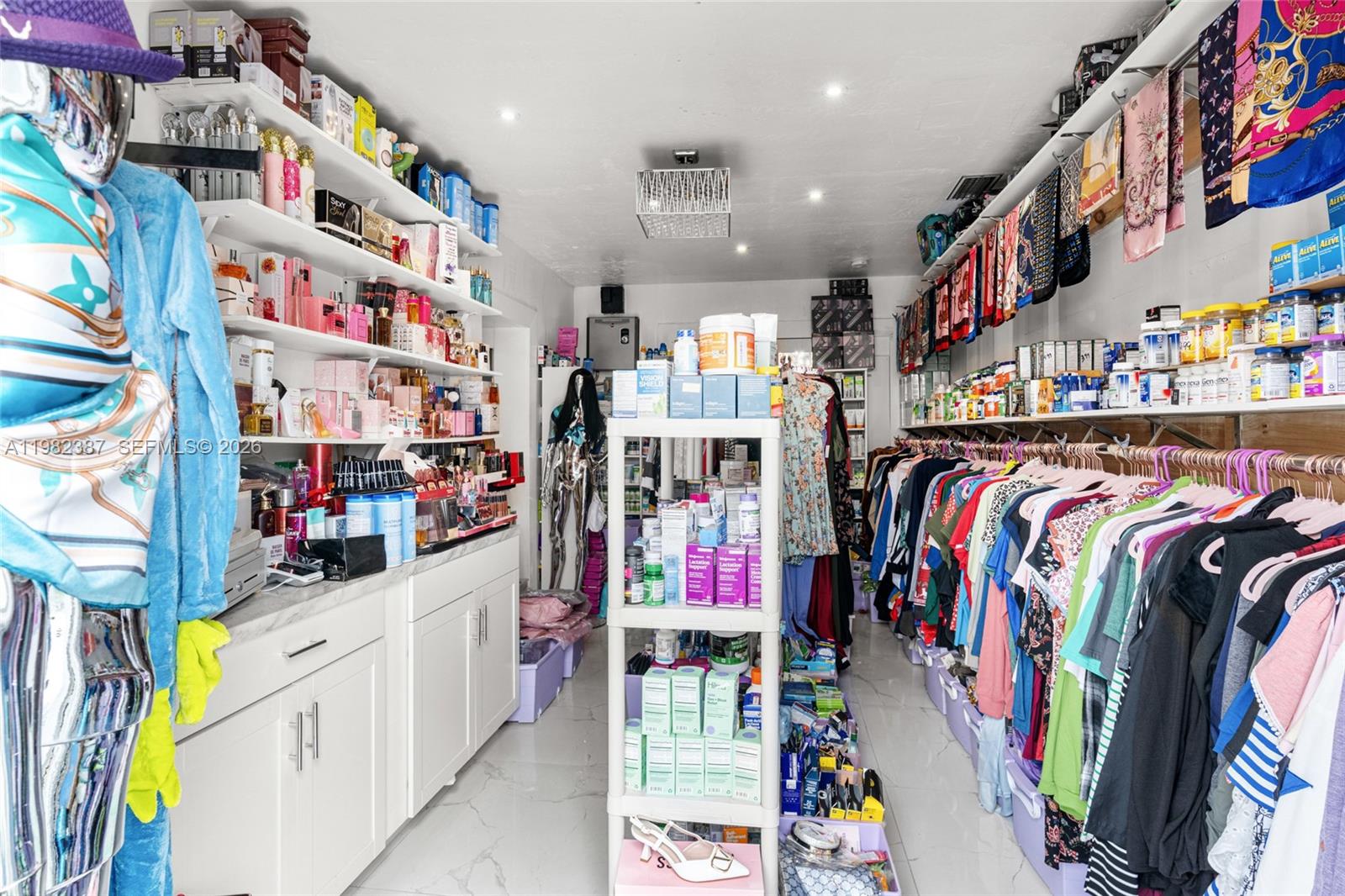 12721 Southwest 47th Street Miami, FL 33175 - Photo 27 of 47 a view of walk in closet with clothes and shoes