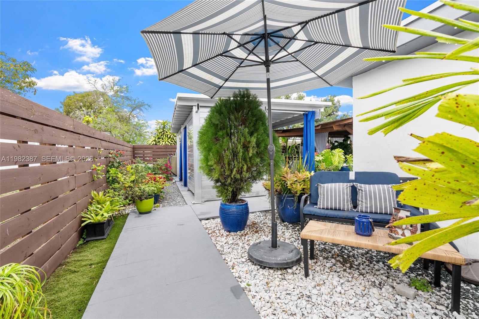 12721 Southwest 47th Street Miami, FL 33175 - Photo 29 of 47 a view of a chair and table in backyard