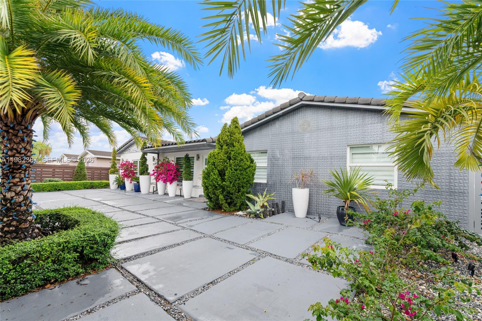 12721 Southwest 47th Street Miami, FL 33175 - Photo 3 of 47 a front view of a house with a yard