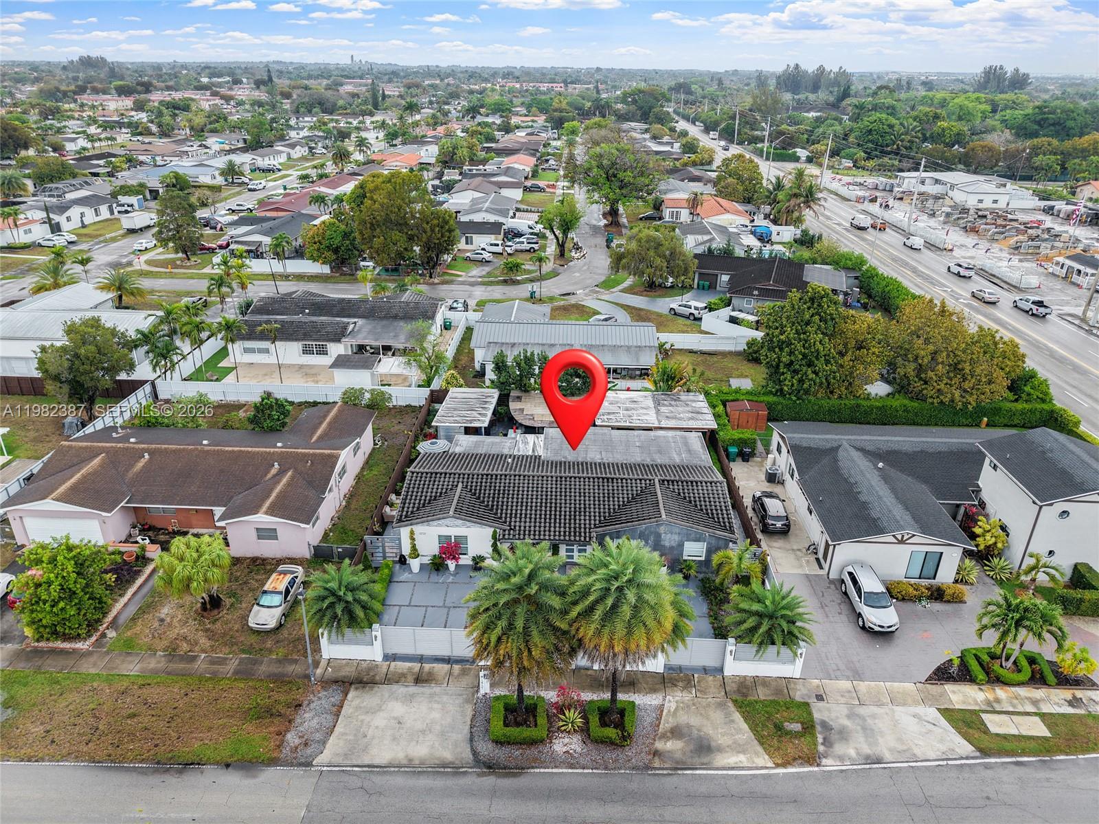 12721 Southwest 47th Street Miami, FL 33175 - Photo 43 of 47 an aerial view of a house with a garden and mountain view