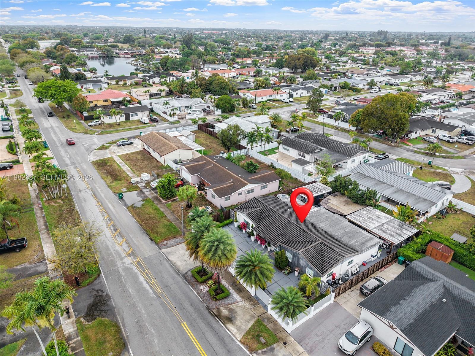 12721 Southwest 47th Street Miami, FL 33175 - Photo 45 of 47 an aerial view of residential houses with outdoor space and parking