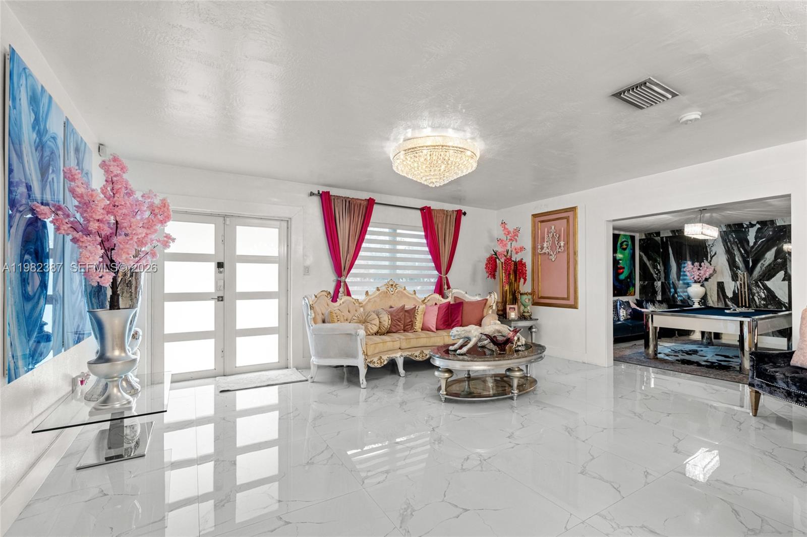 12721 Southwest 47th Street Miami, FL 33175 - Photo 8 of 47 a living room with furniture and a large window