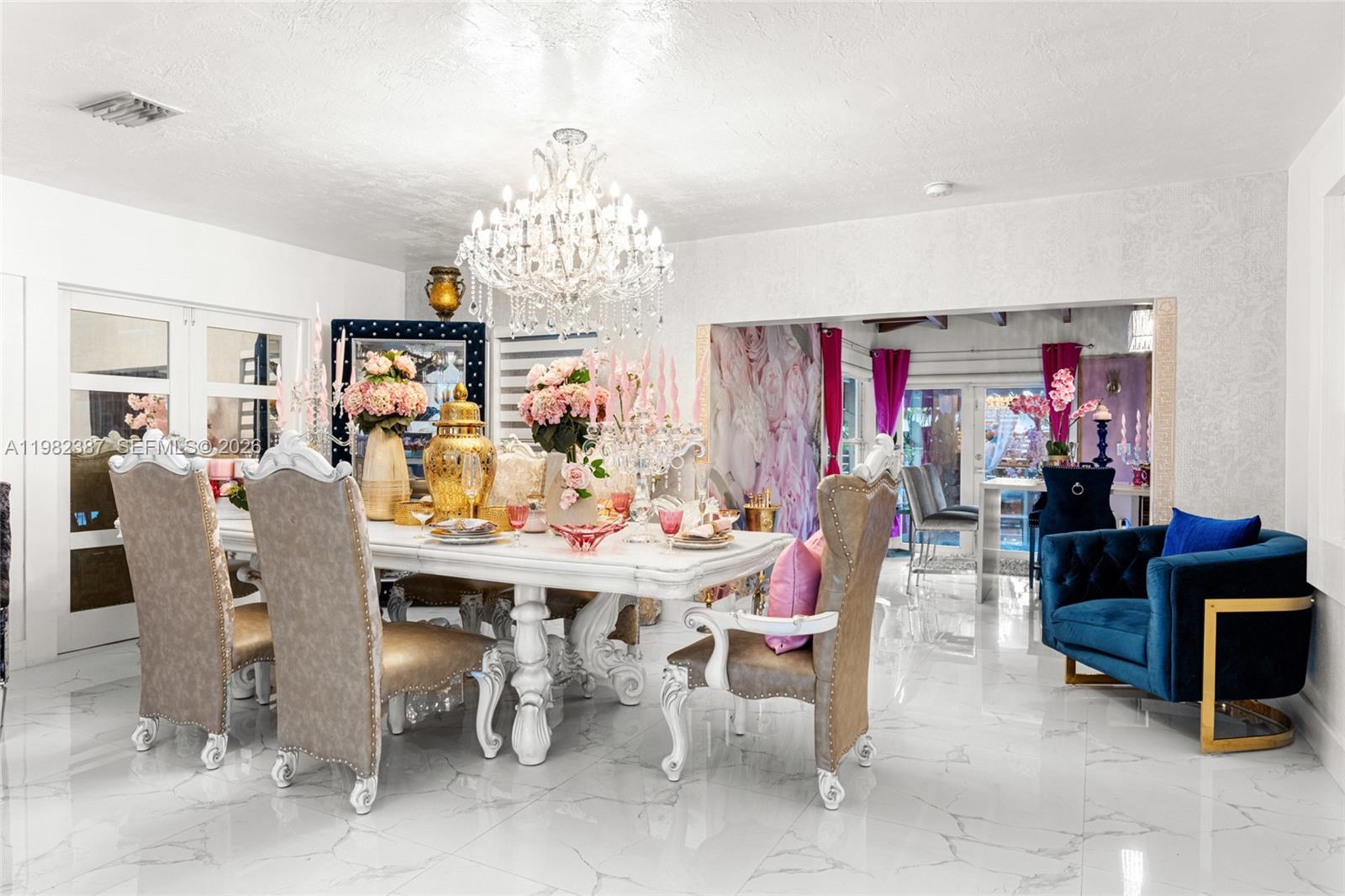 12721 Southwest 47th Street Miami, FL 33175 - Photo 10 of 47 a view of a dining room with furniture a chandelier and window