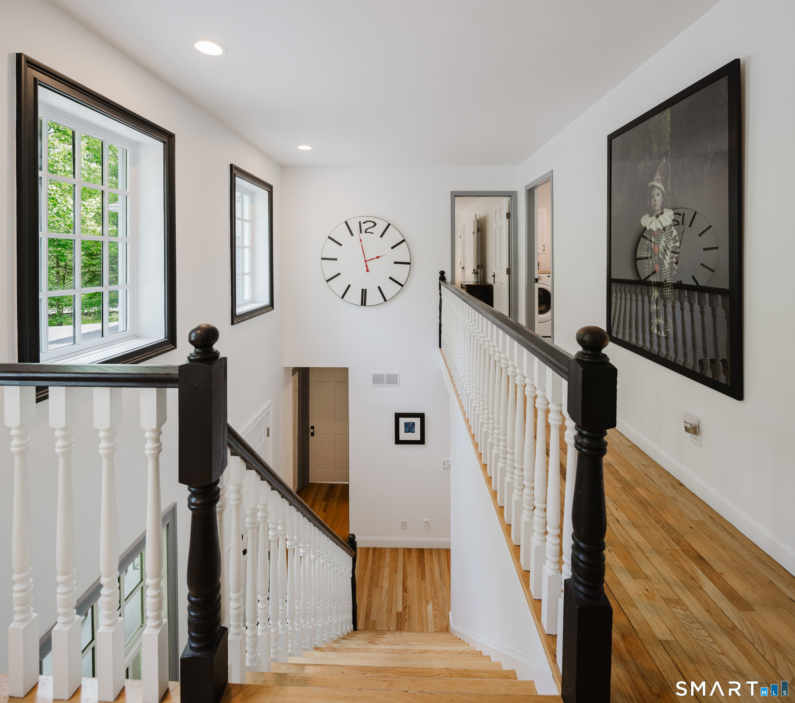 3 Partridge Trail Sherman, CT 06784 - Photo 10 of 37 a view of staircase with lots of frames and flower pot