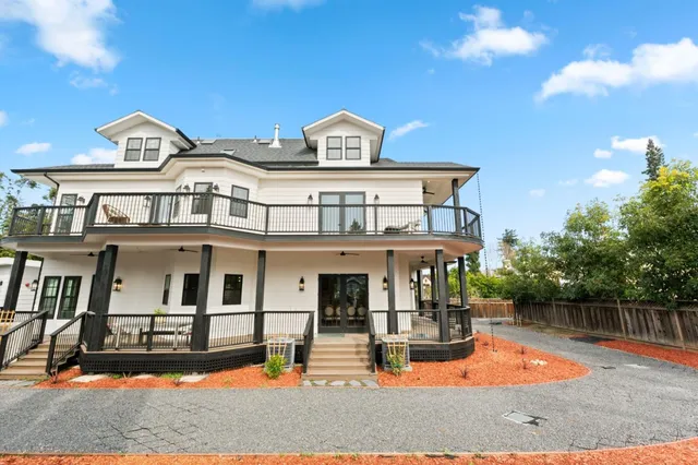 a view of a balcony with wooden floor and city view