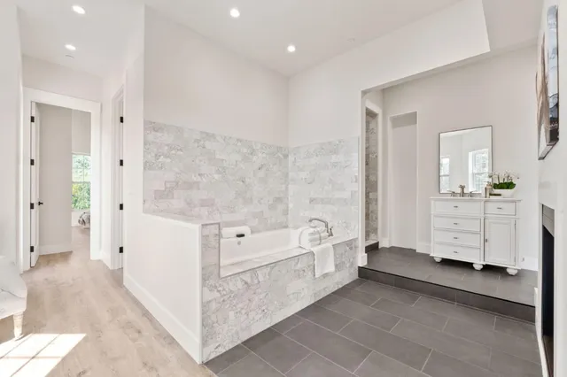 a bed room with a bed and a chair