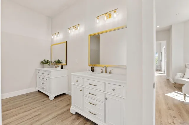 a living room with furniture a rug and a ceiling fan