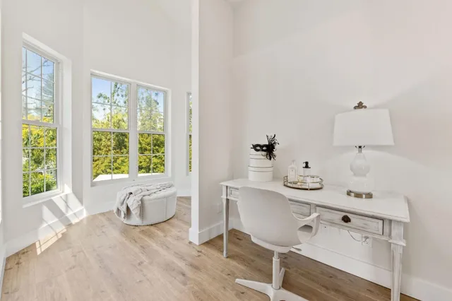 a bathroom with a double vanity sink large mirror and a bathtub