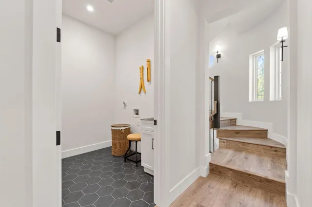 a living room with fireplace furniture and a wooden floor