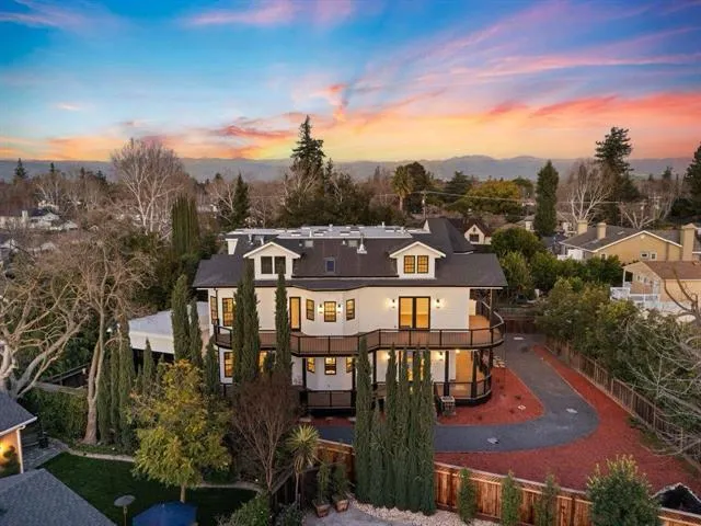 a view of a balcony with floor to ceiling windows with wooden floor