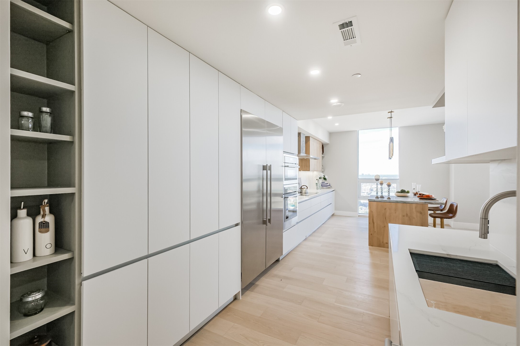 5100 San Felipe Street, Unit 363 Houston, TX 77056 - Photo 23 of 28 a large white kitchen with cabinets