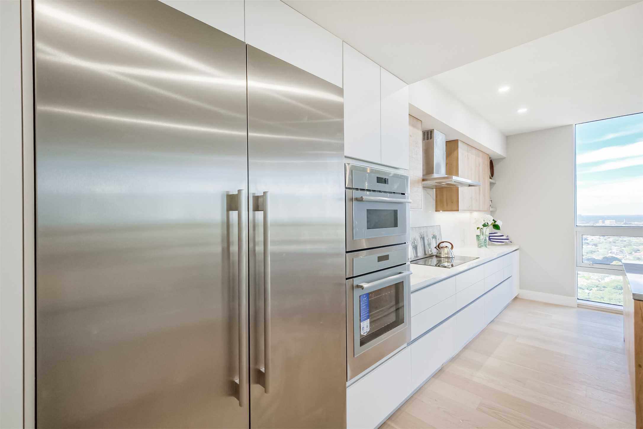 5100 San Felipe Street, Unit 363 Houston, TX 77056 - Photo 24 of 28 a kitchen with stainless steel appliances a refrigerator sink and cabinets