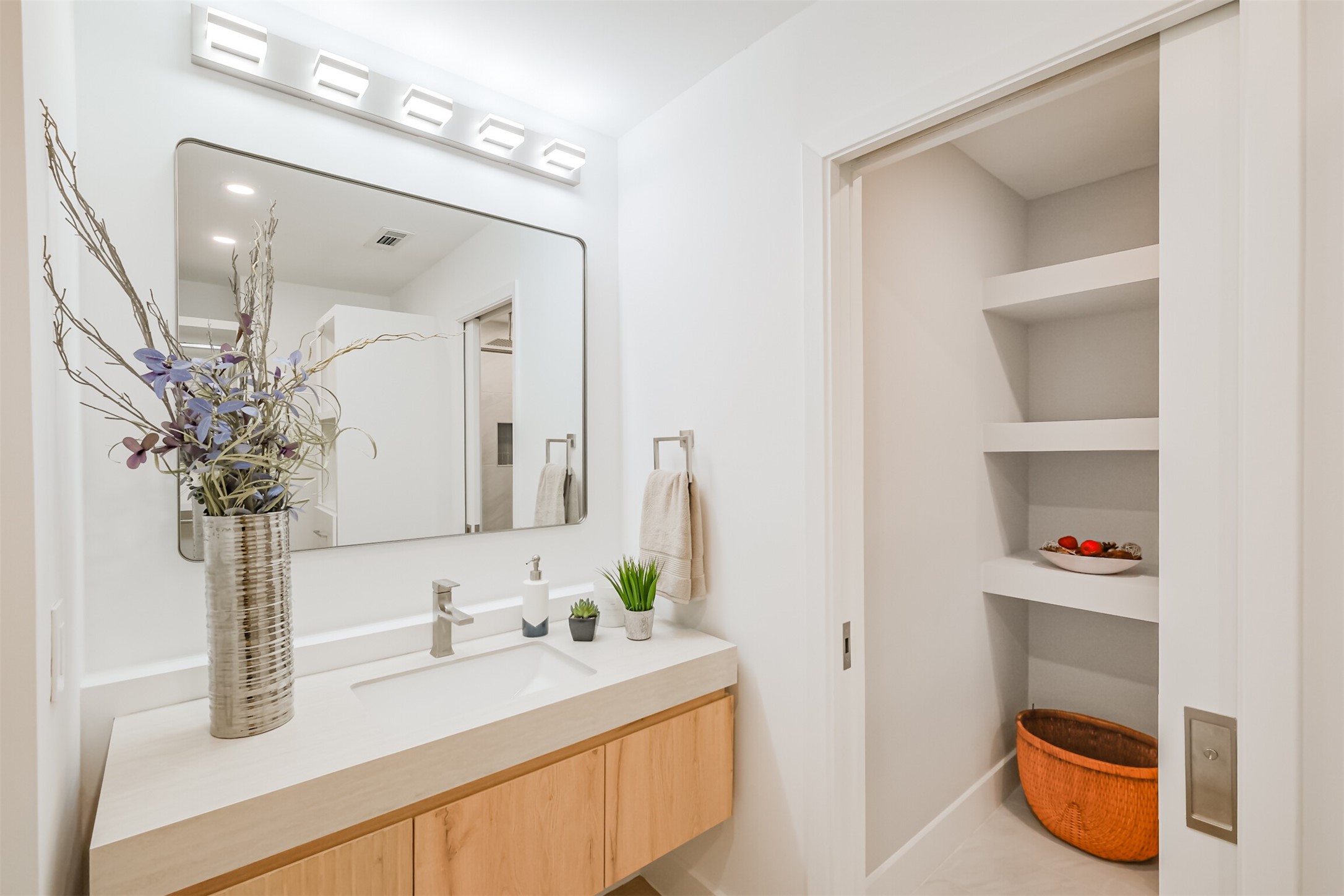 5100 San Felipe Street, Unit 363 Houston, TX 77056 - Photo 6 of 28 a bathroom with a granite countertop sink and a mirror