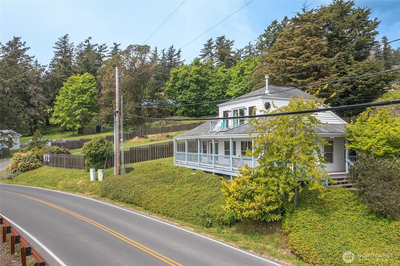 942 Deer Harbor Road Orcas Island, WA 98245 - Photo 2 of 40 a view of a house with a yard