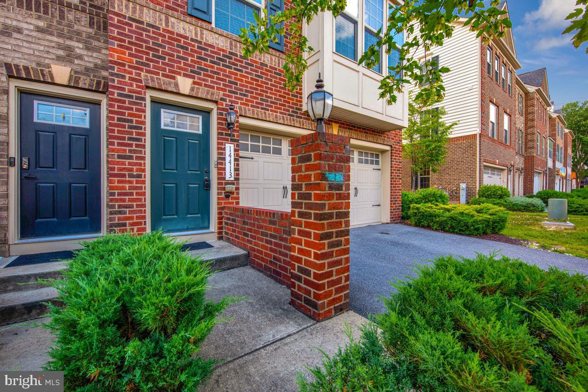 14413 Sandy Ridge Lane Laurel, MD 20707 - Photo 4 of 41 Charming brick facade with lush greenery.