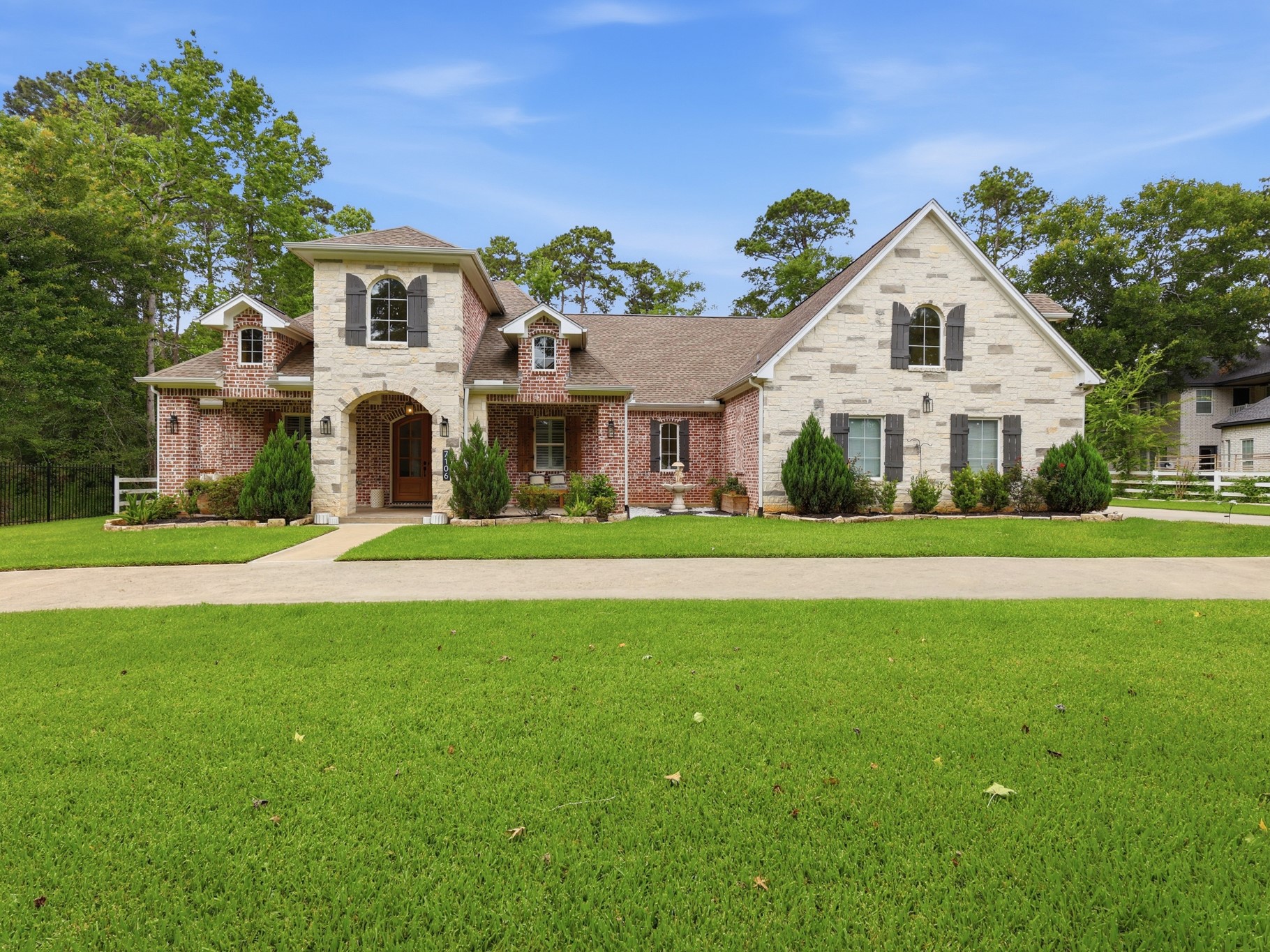 7106 Hampton Court Spring, TX 77389 - Photo 1 of 31 Charming two-story brick and stone home with a spacious front yard, well-maintained landscaping, and a welcoming driveway. Ideal for those seeking a blend of elegance and comfort in a serene neighborhood.