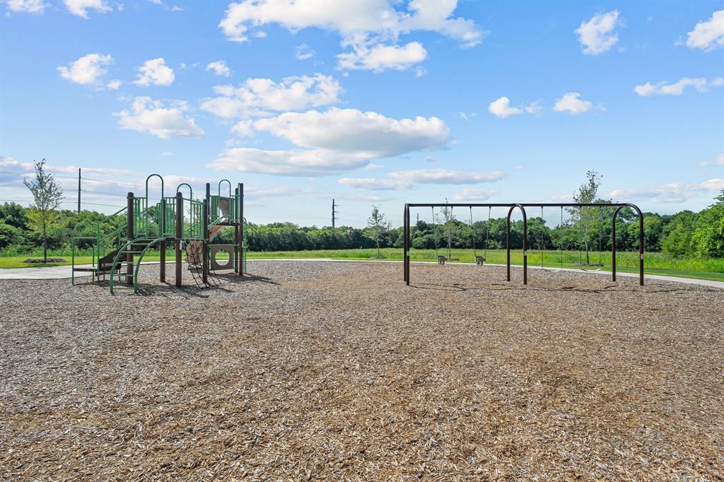 408 Wydown Drive Princeton, TX 75407 - Photo 37 of 40 a view of outdoor space with playground and green space