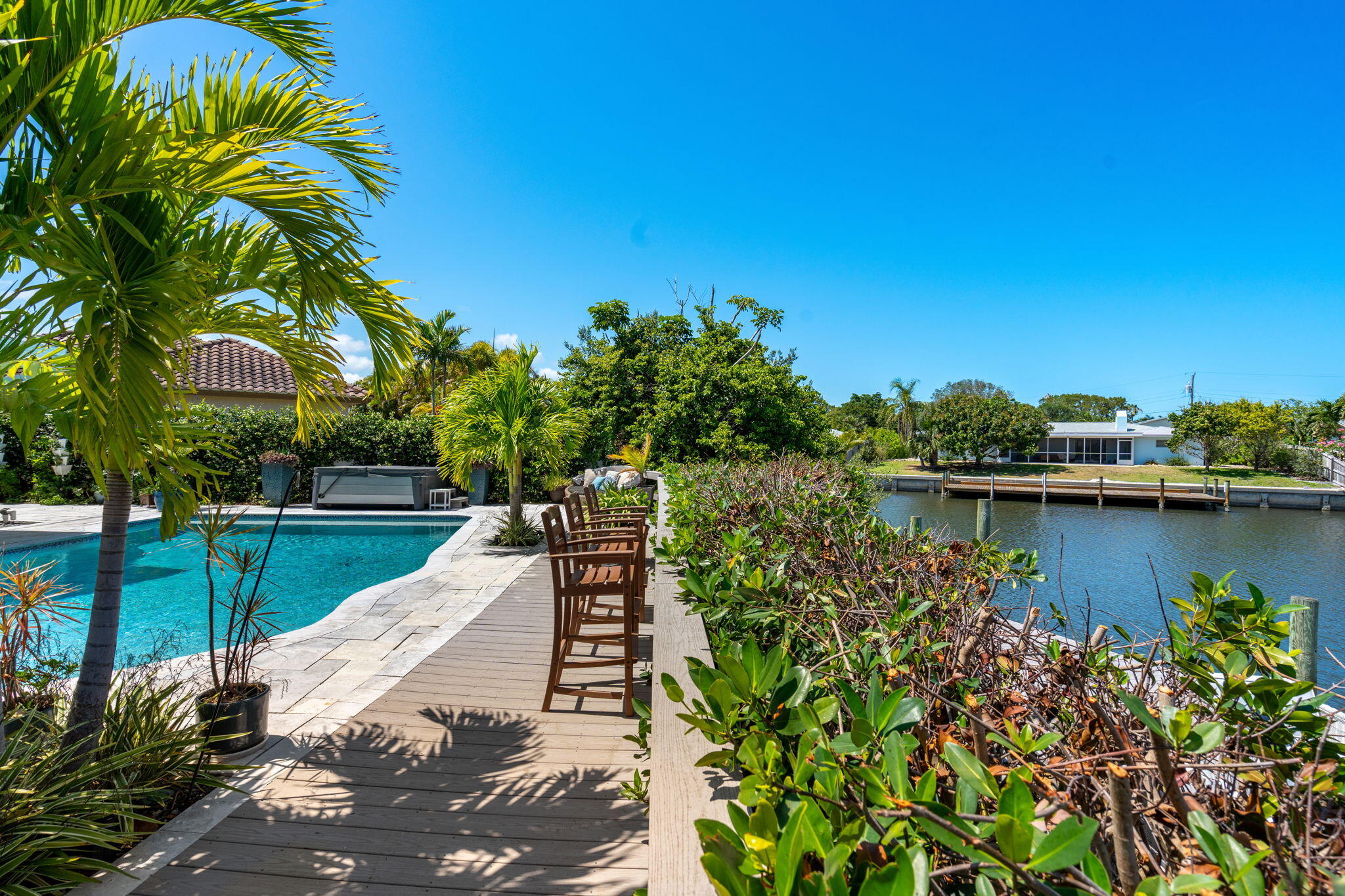 452 Sandy Key Melbourne Beach, FL 32951 - Photo 103 of 140 a view of a lake with a house in the background